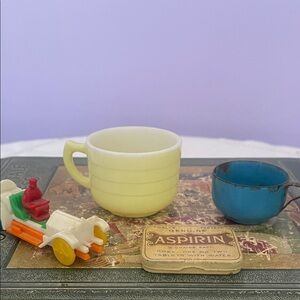Vintage Yellow and Blue Cups with Toy Car and old aspirin tin